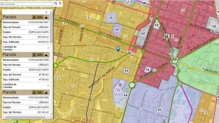 Mapa digital con áreas coloreadas indicando uso del suelo y ventana con datos técnicos de parcelas urbanas